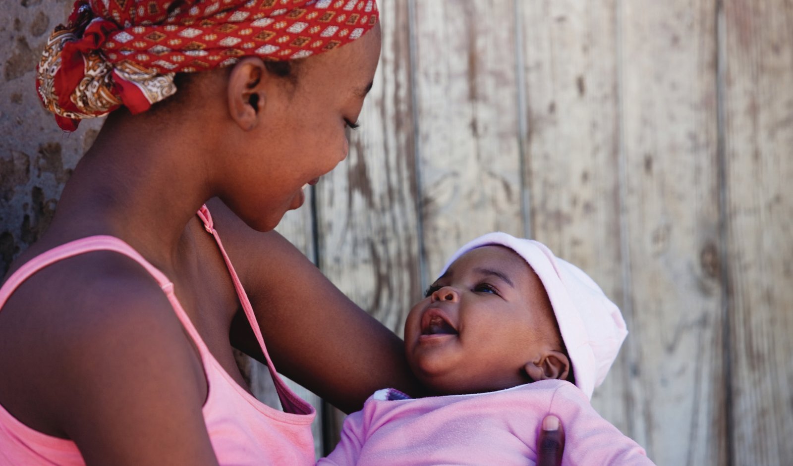 Healthcare professional supporting a mother